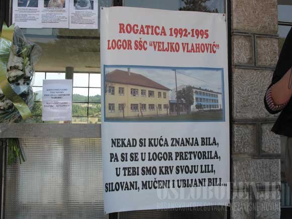 A sign from 2012 in Rogatica, with picture of Veljko Vlahovic Secondery School. "Once You Were A Place O Knowledge, Then A Prison Camp Were We Spilled Our Blood, Were Raped, Tortured And Killed...